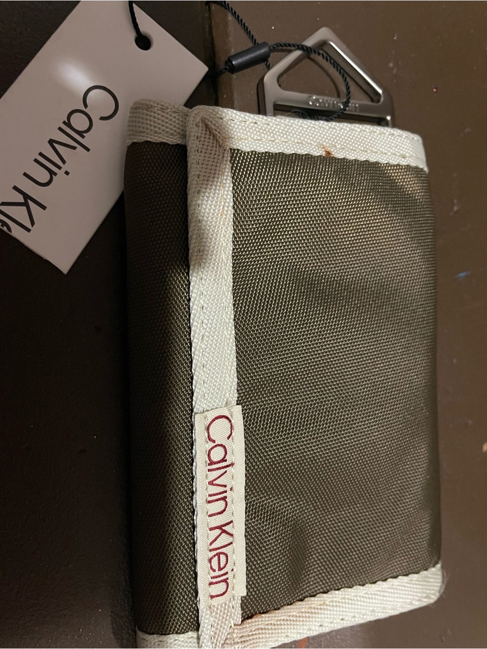 Calvin Klein Brown Tri-Fold Wallet with Cream Trim.